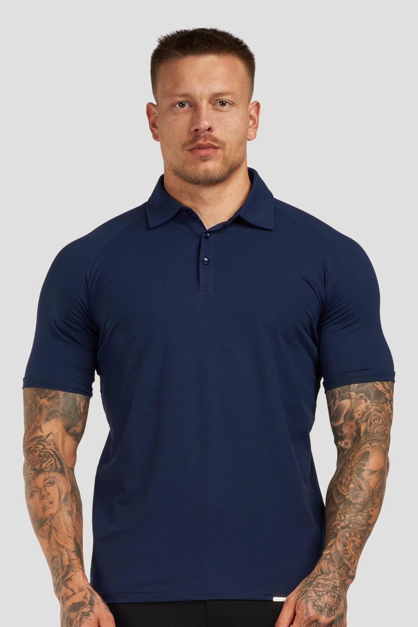 THE MUSCLE BUTTON POLO