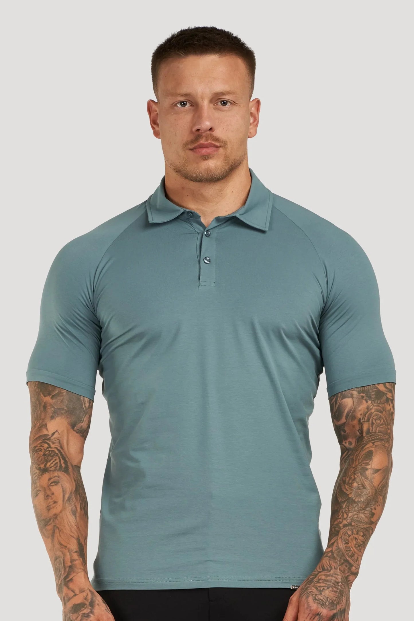 THE MUSCLE BUTTON POLO